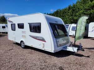 Caravan with spacious interior and modern amenities, ideal for family holidays and outdoor adventure.