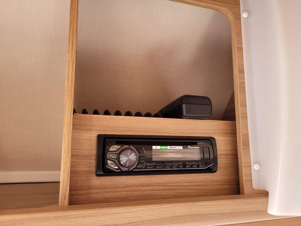 Custom van interior with audio system by Ridgeway Tourers.