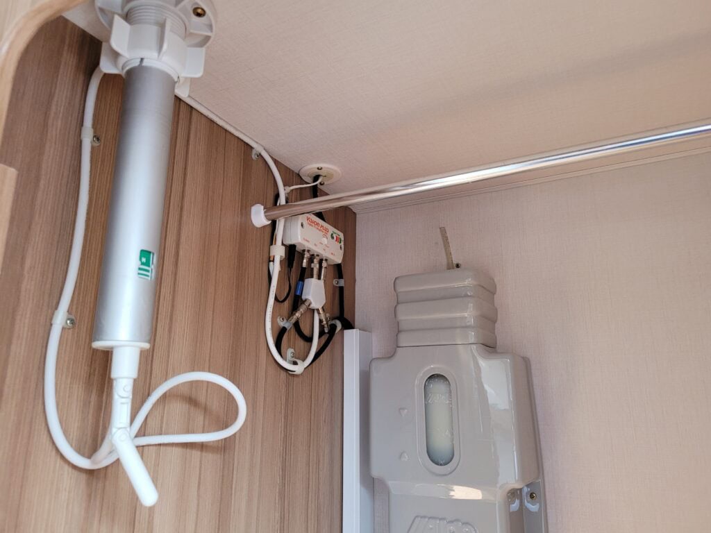 Water system setup with plumbing and filtration for campervan conversions.