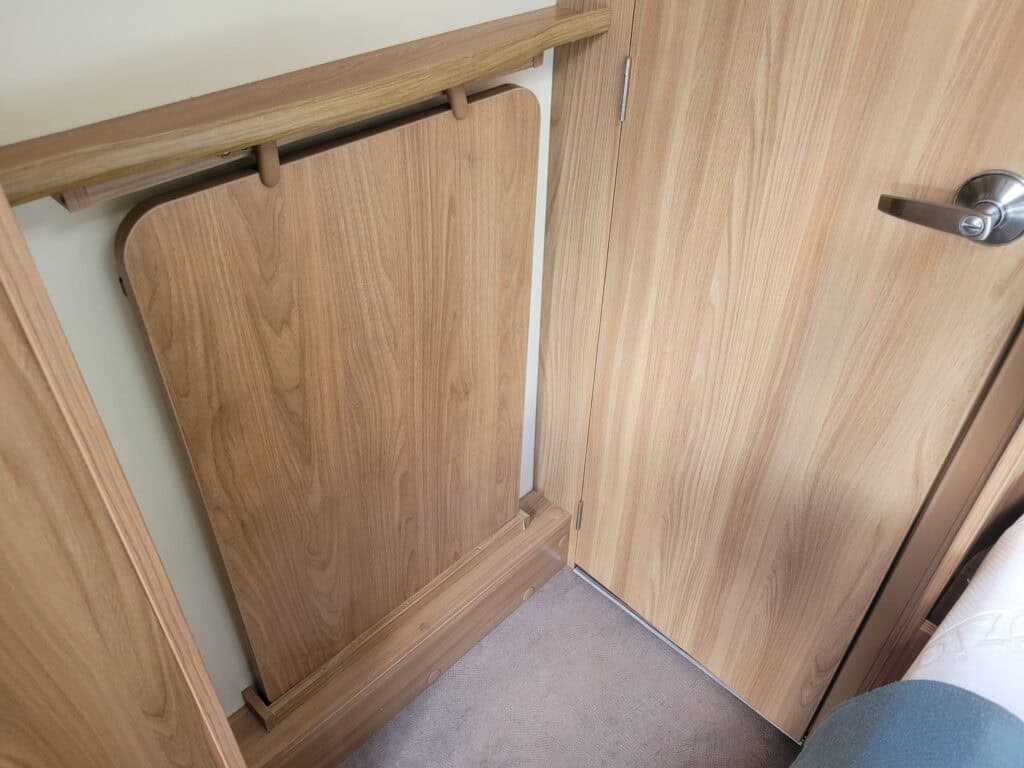 Folding bed by Ridgeway Tourers, designed for space-saving comfort in camper vans and motorhomes.