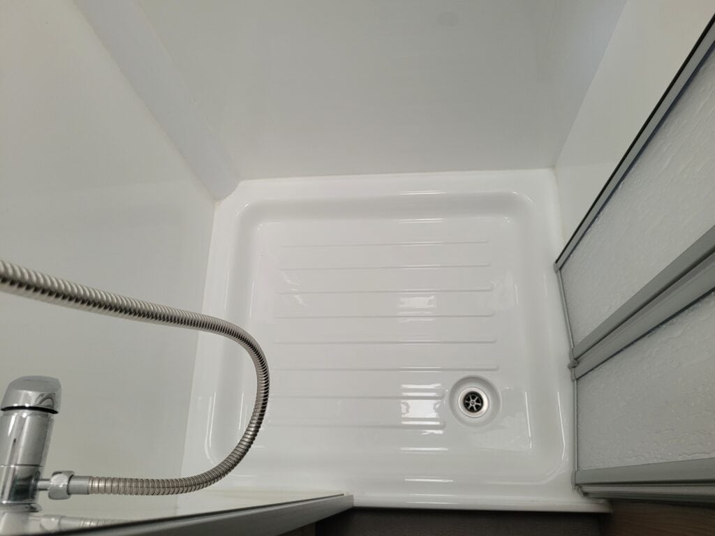 Shower tray installed in a modern bathroom at Ridgeway Tourers.