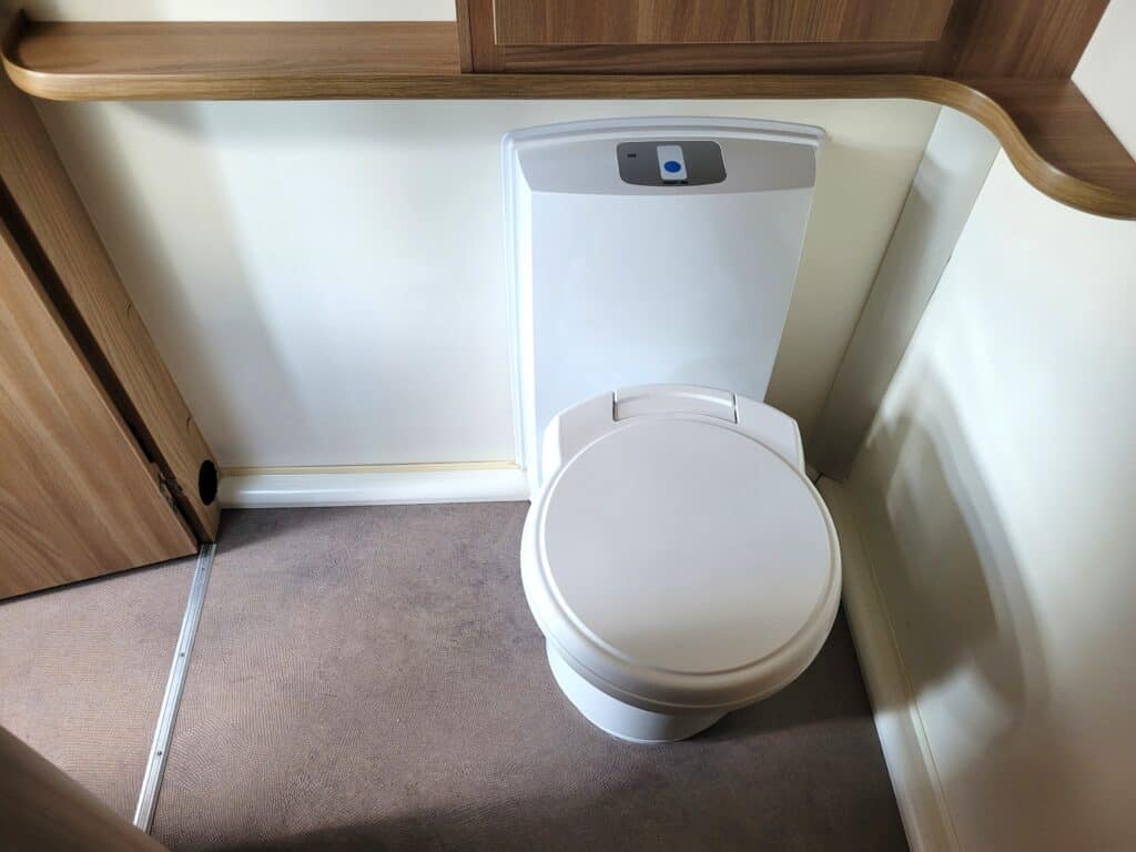 Modern RV toilet with sleek design and advanced flushing technology.