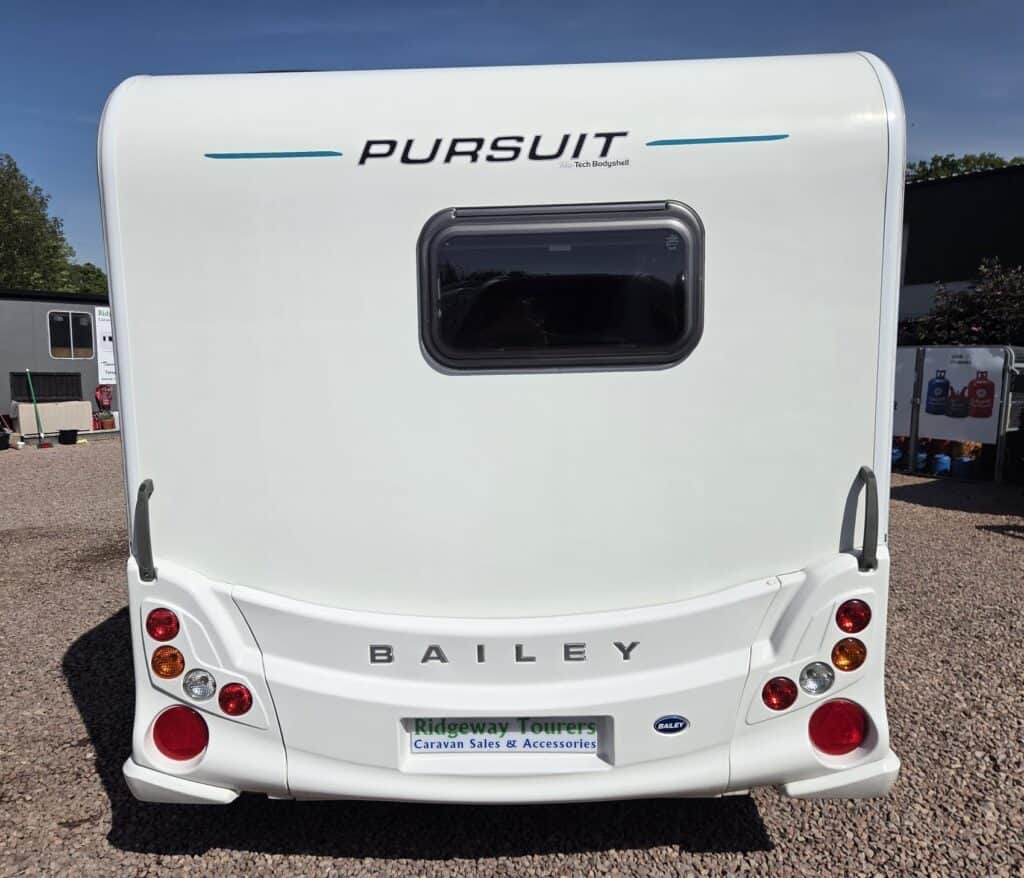 Modern Bailey Pursuit caravan with sleek design and rear window, ideal for touring and holidays.